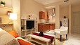 Seville Apartment - The kitchenette forms part of the living area.