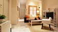 Seville Apartment - View of the living room with the apartment entrance at the far end.