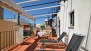 Sevilla Ferienwohnung - Private terrace with garden furniture, canopy and plants.