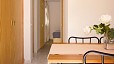 Seville Apartment - View towards the bedroom from the dining area. On the left there is a large built-in wardrobe.