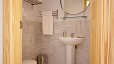 Seville Apartment - Full bathroom with shower.