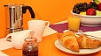 Seville Apartment - The kitchen has a small breakfast-dining table.