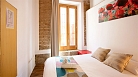 Granada Apartment - Studio apartment with wooden flooring and exposed wooden beams.