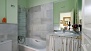 Sevilla Ferienwohnung - Bathroom 1 with bathtub and a shower head (inside bedroom 1).