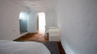 Granada Apartment - Terracotta flooring gives the only touch of colour.