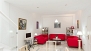 Séville Appartement - Spacious living area with 3 sofas, central table, TV and DVD player.