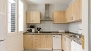 Séville Appartement - Kitchen well equipped for self-catering. With washing machine and dishwasher.