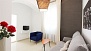 Sevilla Apartamento - Living area. The apartment is on the ground floor of a residential building with a patio.
