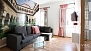Sevilla Apartamento - Living area with sofa, coffee table and TV.