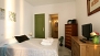 Seville Apartment - Double bedroom with an en-suite bathroom.