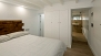 Seville Apartment - Bedroom 2. A short corridor leads to the en-suite bathroom.