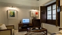 Séville Appartement - Living area with TV. There is free WIFI internet access.