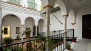 Sevilla Ferienwohnung - The apartment forms part of a Casa Palacio decorated with a colonnade of arches.