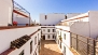 Seville Apartment - View of the building courtyard from the terrace.