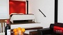 Séville Appartement - The bedroom alcove has a comfortable double bed and overlooks the living area.