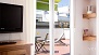 Séville Appartement - Sliding doors open onto the terrace.