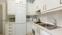 Sevilla Ferienwohnung - Large kitchen with oven, dishwasher and washing machine.