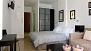Sevilla Ferienwohnung - The sleeping area has twin beds placed together and a large wardrobe.