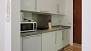 Séville Appartement - The kitchenette is well-equipped with appliances and utensils for self-catering.
