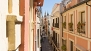 Sevilla Apartamento - Cuna street viewed from the living room. At the far end is La Giralda - tower bell of the Cathedral.