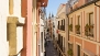 Séville Appartement - Cuna street viewed from the living room. At the far end is La Giralda - tower bell of the Cathedral.