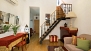 Séville Appartement - View of the living area towards the apartment entrance door.