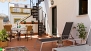 Seville Apartment - Private terrace with 2 deck chairs, table and chairs.