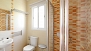 Seville Apartment - Bathroom with wash basin, toilet and shower.