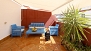 Séville Appartement - The terrace is decorated with garden furniture and potted plants.