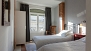 Sevilla Apartamento - Bedroom 2 has two twin beds and a wardrobe.