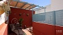 Sevilla Apartamento - Detail of sun-beds and plants.