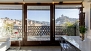 Granada Apartment - The glass wall of the apartment with central door onto the balcony.