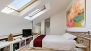 Granada Ferienwohnung - The sleeping area has wooden flooring and velux windows.