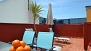 Sevilla Apartamento - The private roof-terrace features outdoor seating and a table.