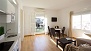 Seville Apartment - Living area. Glass doors open to the terrace.