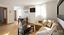 Séville Appartement - Living area with double sofa-bed for any additional guests.