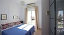 Sevilla Apartamento - Bedroom 1: Sliding glass doors open to the first of two terraces.