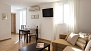 Seville Apartment - The living area gives access to the second terrace (the glass door beyond the table).