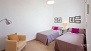 Séville Appartement - Second bedroom with 2 single beds.