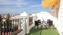 Sevilla Ferienwohnung - Second terrace, with outdoor furniture and a sun canopy.