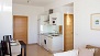 Seville Apartment - Extendable dining table and open-plan kitchen equipped for self-catering.