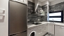Sevilla Apartamento - Modern kitchen complete with washing machine and dishwasher.