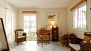 Sevilla Apartamento - The master bedroom has its own seating area with desk and chairs (upper level).