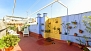 Séville Appartement - Roof-top terrace with outdoor shower, canopy, table and chairs.