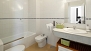 Seville Apartment - En-suite bathroom complete with bathtub.