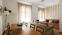 Seville Apartment - Large dining table with chairs.