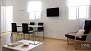 Seville Apartment - Dining area with table and chairs.