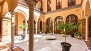 Seville Apartment - Patio of the house. The facing 3 large arched doors belong to the apartment.