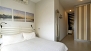 Seville Apartment - Bedroom with a large mirror and fitted wardrobe to store your belongings.