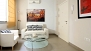 Sevilla Apartamento - Living room. The door on the right is the apartment entrance door.